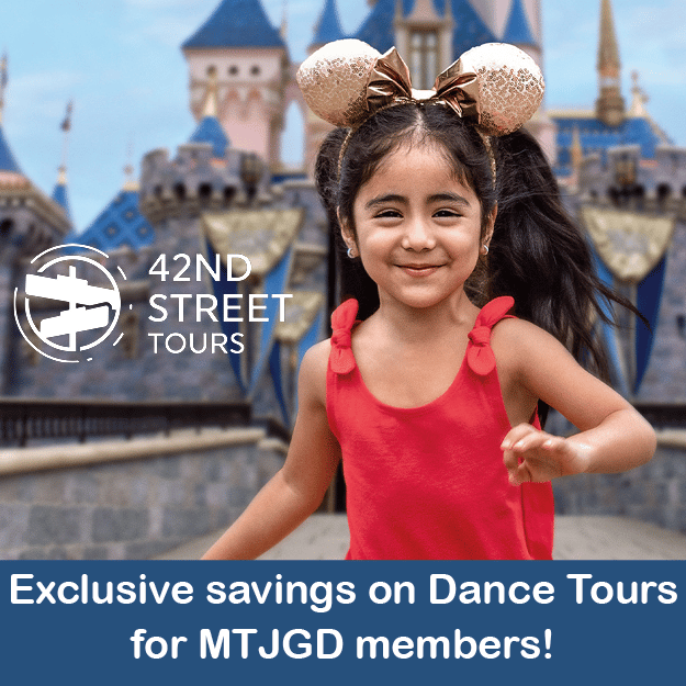 Young girl in red shirt wearing mini mouse ears outside at Disney world