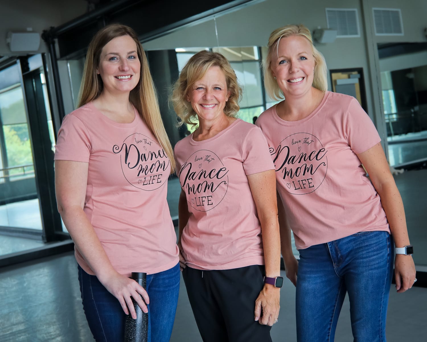 three dance moms in matching pink tshirts